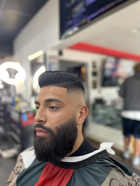 High-top fade with shaped beard